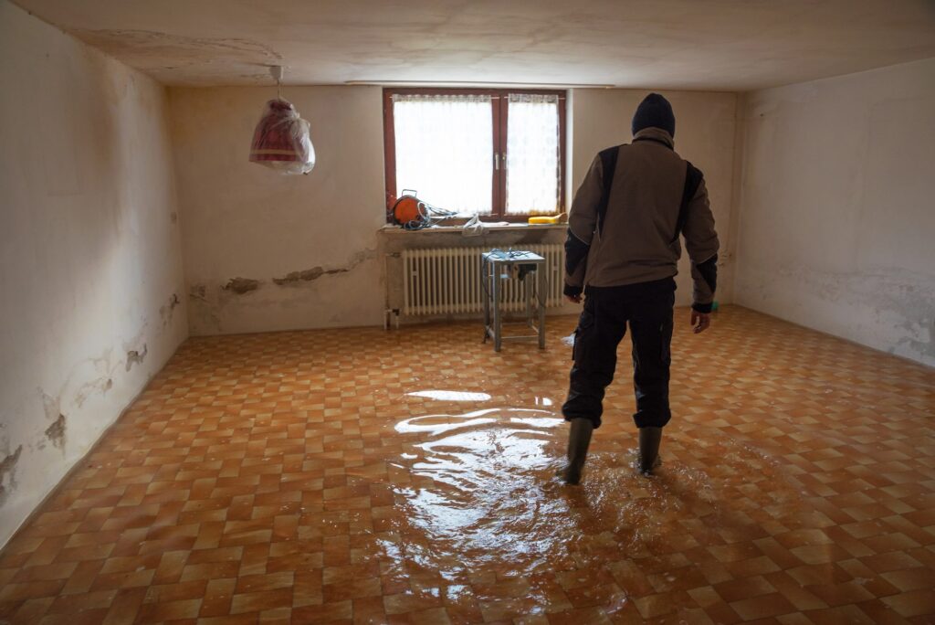 man in flooded basement