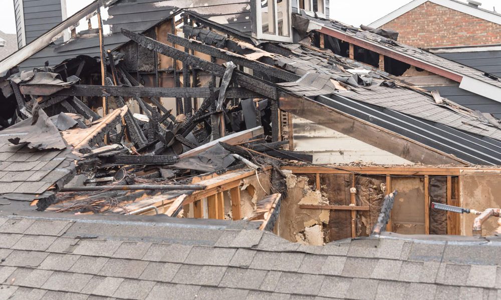 Wooden roofing beams destroyed, exposed, and burnt